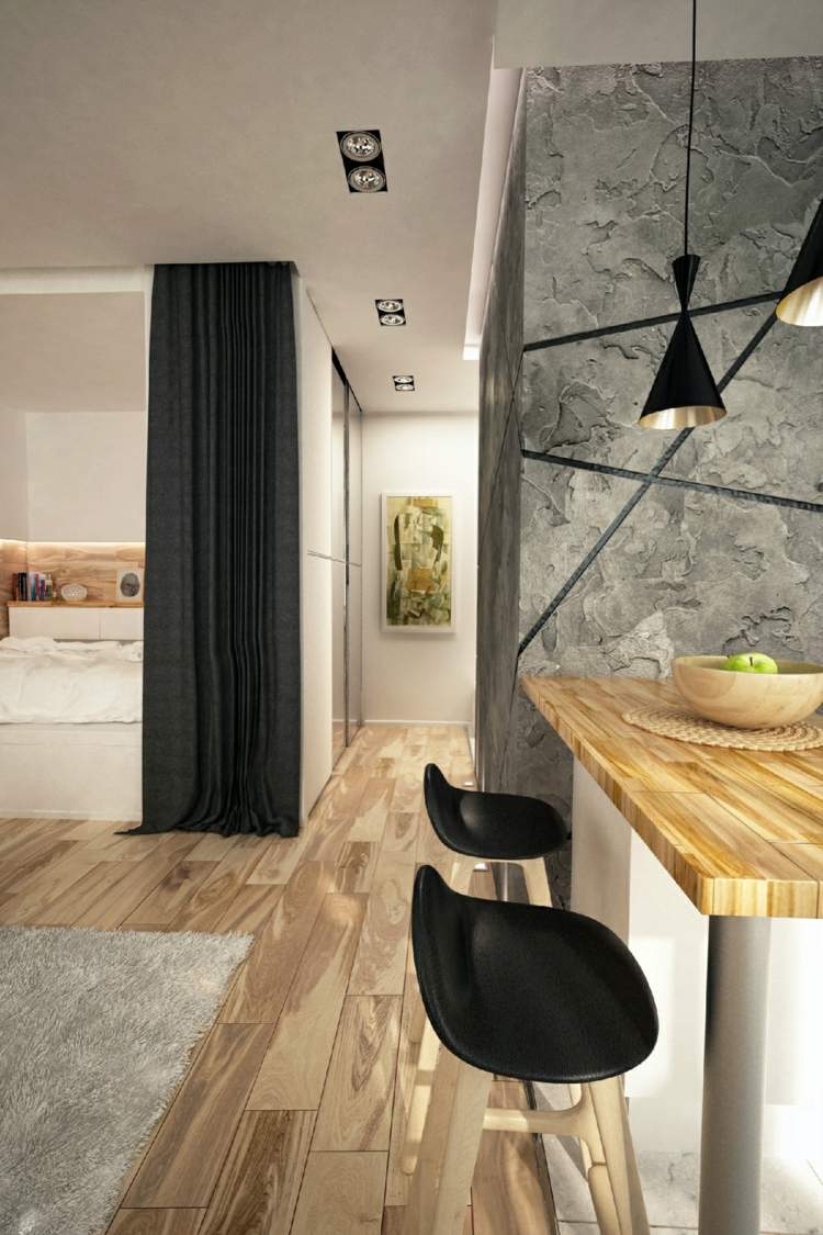 zariadenie 1 izbový byt drevená svetlá taburetka čierny koberec sivá