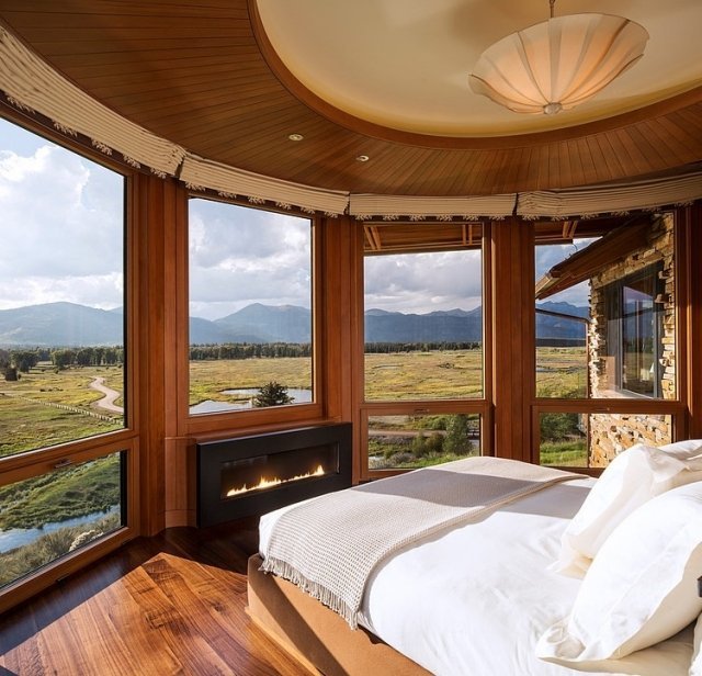 rustikálna spálňa okolo panoramatického okenného krbu rustikálny-spálňa-okrúhly-obrázok-okenný krb