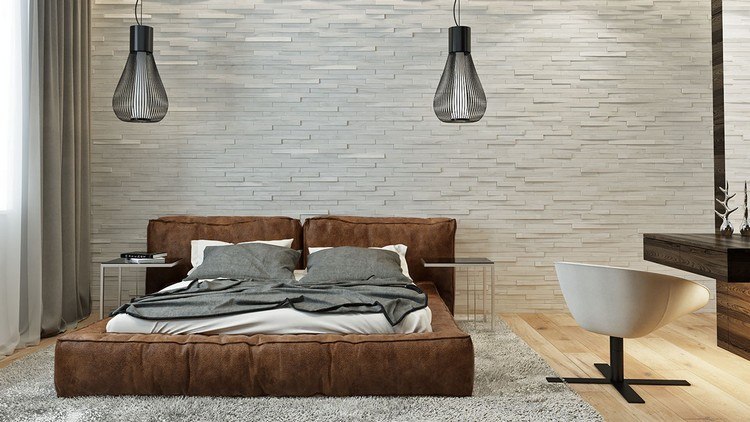 Stenový dizajn v spálni s bielymi lícovými tehlami Zariadenie v prírodných tónoch-nápady na bývanie-spálňa-biele tehly-čalúnená posteľ, koža-čierne, závesné svetlá