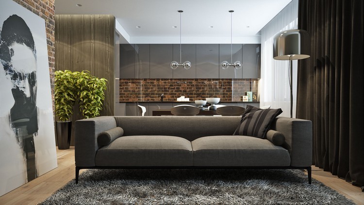 Pohovka, koberec a predné diely v šedo - červených tehlách ako kontrast Zariadenie v prírodných tónoch mestská obývacia izba-sivá-kuchyňa-tehlové akcenty