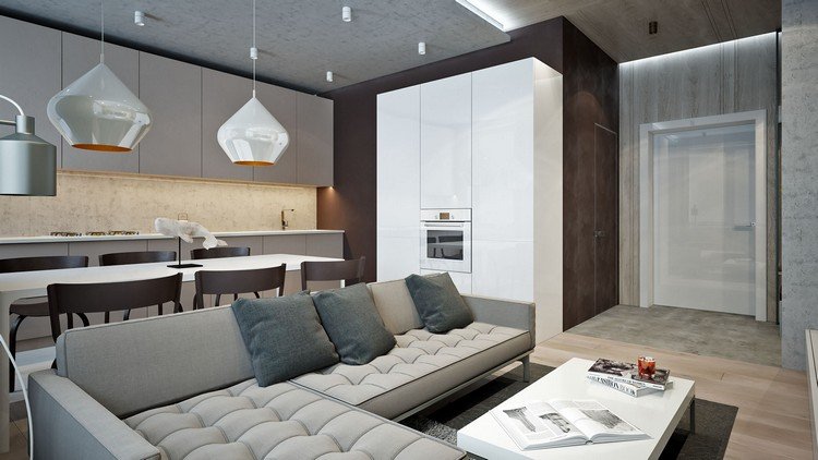 Rohová sedačka a predné diely v šedej farbe - stena v čokoládovej farbe a biela skrinka nábytok-prírodné-tóny-svetlo-sivá-obývačka-kuchyňa-čokoládovo-hnedá-akcentovaná stena-biela-skriňa