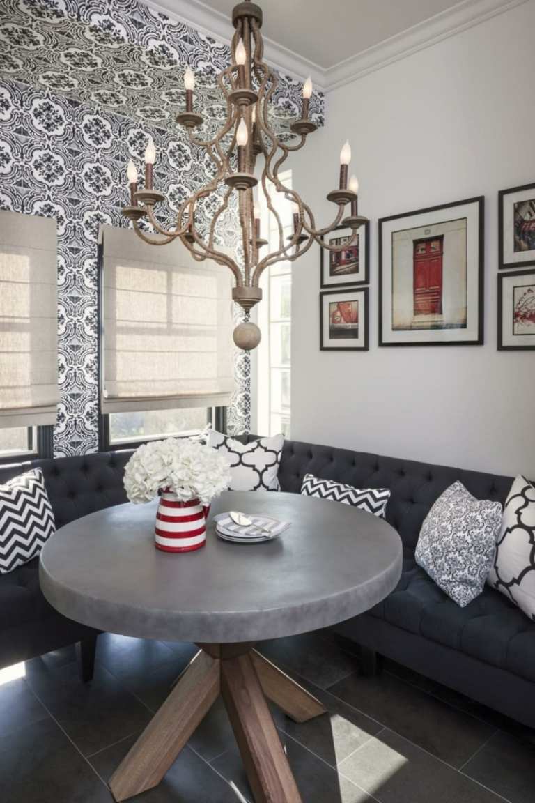 Moderný nápad na posedenie v sivých odtieňoch Sedacia časť v kuchyni moderný okrúhly jedálenský stôl kamenná tapeta šedá sedačka