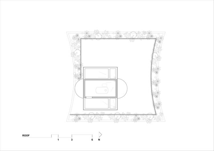Rodinný dom s vysokým kamenným múrom a so záhradou