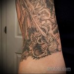 Egy eredeti példa egy meglévő tetoválásra Mihály arkangyal - a rajz alkalmas Mihály arkangyal tetoválására a vállán