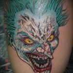 fotó a 694 -es joker tetoválásról - a minta hűvös változata, amely sikeresen használható feldolgozásra és joker tetoválásként történő alkalmazásra a karon