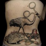 Eredeti példa egy alkalmazott tetovált sündisznóra - a rajz alkalmas egy sün tetoválására a gyomorban