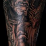 Fotó a Jézus Krisztus tetoválásról, 522. szám - a rajz érdekes változata, amely könnyen használható a feldolgozásra és a Jézus Krisztus tetoválására a csuklón