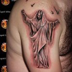 Fotó a Jézus Krisztus tetoválásról, 219. szám - a rajz hűvös változata, amely sikeresen felhasználható Jézus Krisztus vállán lévő tetoválásként való átalakítására és alkalmazására