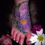 Az írisz tetoválás remek példája - a rajz alkalmas a kar írisz tetoválására