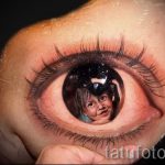 fotó tetoválás gyermek portréja - tükröződésként a szem pupillájában