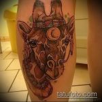 Oryginalny przykład istniejącego tatuażu żyrafy - rysunek nadaje się do tatuażu żyrafy na przedramieniu