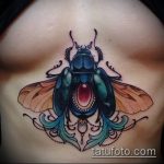 A bogár tetoválás remek példája - a rajz alkalmas egy kereszttel ellátott bogár tetováláshoz