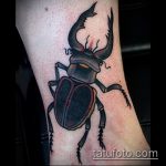 A bogár tetoválás remek példája - a rajz alkalmas egy kereszttel ellátott bogár tetováláshoz