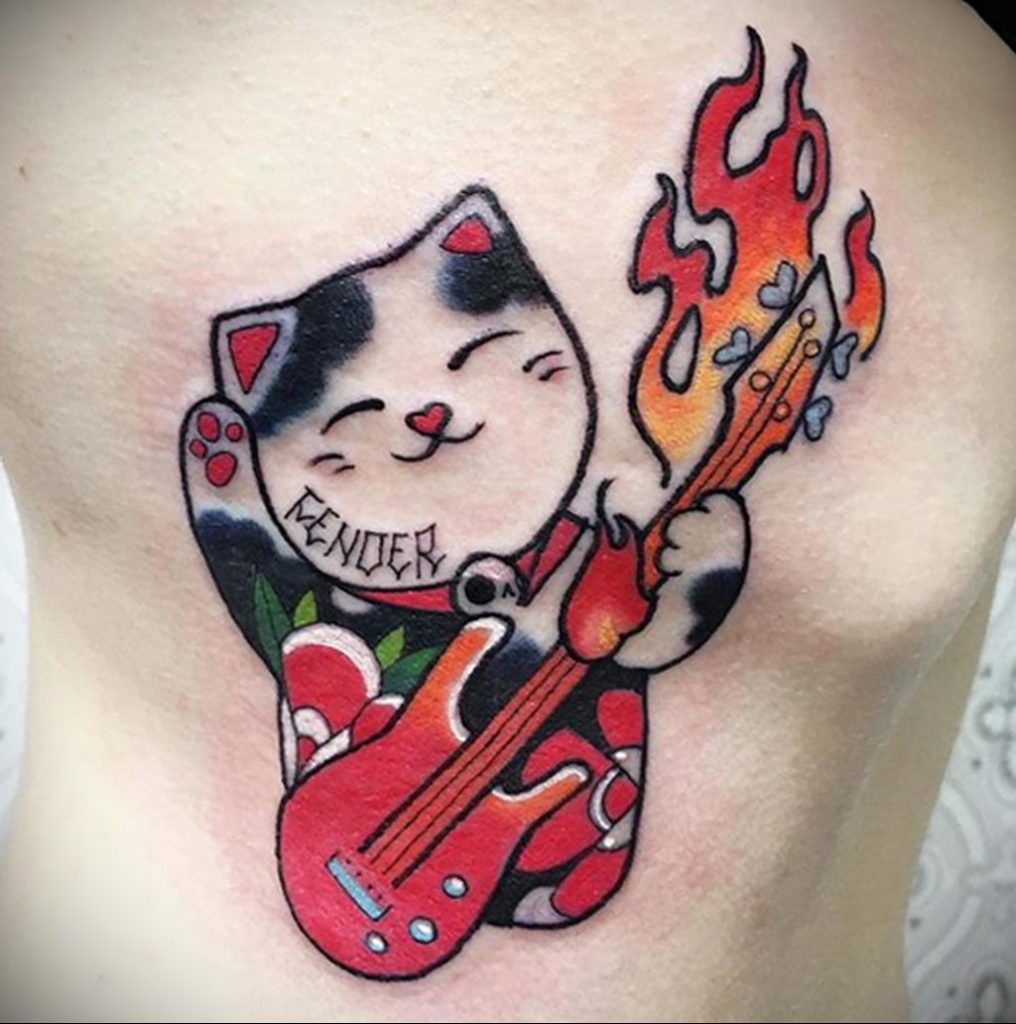 Śmieszne zdjęcie tatuażu kota i gitary