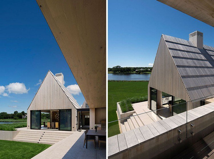 sivý drevený fasádny fasádny dom s terasou so šikmou strechou