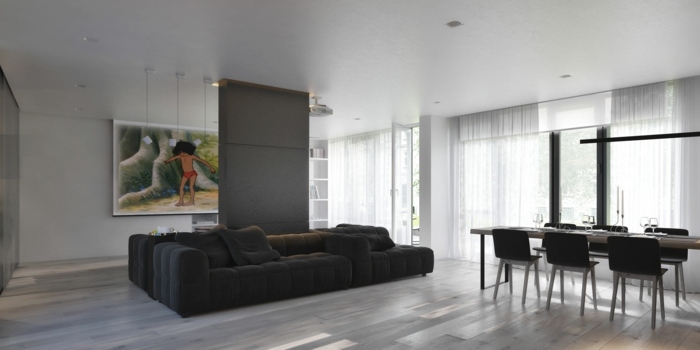 Návrh domu od Igora Sirotova Architect v monochromatickom vzhľade obývacia izba jedálenský kút jedálenský stôl gauč laminát sivé plátno