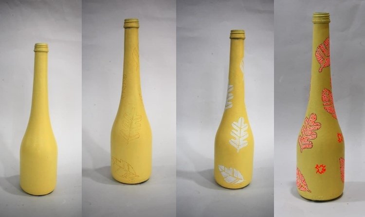 Farebné fľaše s jesennými listami s bodkami