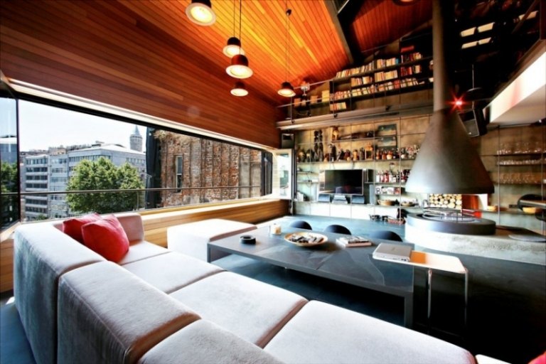Loft Karaköy má priemyselný štýl so závesným kovovým krbom Karaköy-Loft-obývačka-závesný-industriálny-štýl-krb-obývacia krajina