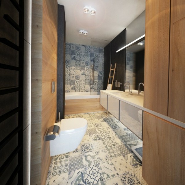 3-dlaždice-s-asymetrickými figúrkami-v-šedej-na-podlahe-a-na-stene