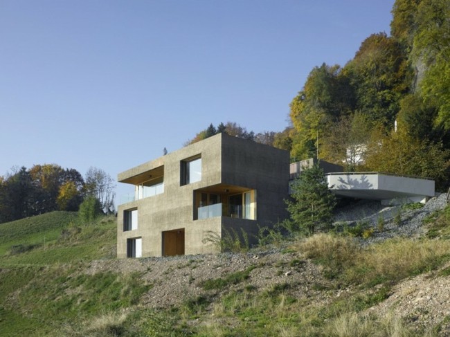 moderná architektúra Švajčiarsko pohľadové betónové okno Švajčiarsko vystavené betónové okenné sklenené skalné lesy