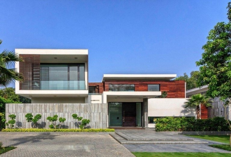 Minimalistický dom - fasádny dizajn s drevom a kameňom moderný-terasový dizajn-rodinný dom-fasáda-predzáhradka