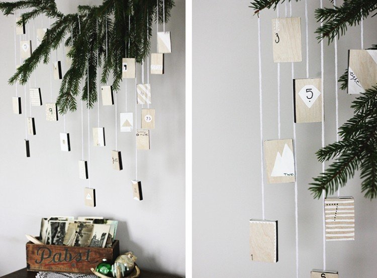 Vyrobte si zo škatúľ so zápalkami jedinečný adventný kalendár moderné-vianočné dekorácie-drotár-advent-kalendár-jedľové vetvy-zápalková škatuľka-zavesenie-výrokov-kreatívny nápad