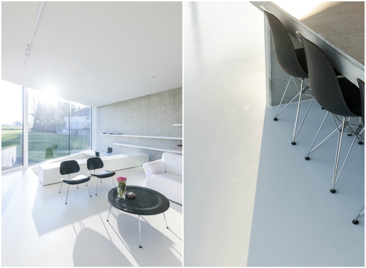 Obývacia časť biely pohľadový betón čierny panoramatické okno