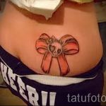 Bogen Tattoo auf dem unteren Rücken - Foto Beispiel des fertigen Tätowierung 02052016 2