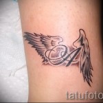 a tetoválás nevének betűje - a kész tetoválás fotója - 20122015 № 6