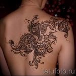 csipke tetoválás a hátán - fotó példa a kész tetoválásra 10