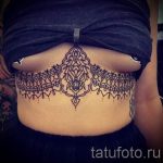 csipke tetoválás a mell alatt - fotó példa a kész tetoválásra 2