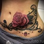 csipke tetoválás a hasán - fotó példa a kész tetoválásra 1