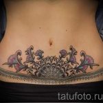 csipke tetoválás a hasán - fotó példa a kész tetoválásra 2