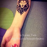 oroszlán tetoválás a karon - törzsi körvonalak