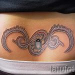 farokcsont tetoválás - fényképes példa egy kész tetoválásra a testen 3