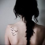 татуировка на птица на лопатката 1