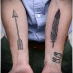 toll - fogak és nyíl - tetoválás toll fotó