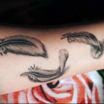 három toll karos tetoválás