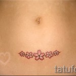 Sakura tetoválás a hasán - Fotó példa a 12122015 számra 3