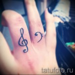 Treble Clef Tattoo On Finger 2 Pics