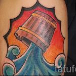 Aquarius tatouage sur son bras - fénykép - un exemple du tatouage fini 01082016 1017 tatufoto.ru