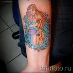 Vízöntő tetoválás az alkarján - fotó - példa a kész tetoválásra 01082016 3030 tatufoto.ru
