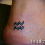 Vízöntő szimbólum tetoválás - fotó - példa a kész tetoválásra 01082016 3071 tatufoto.ru