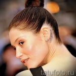 szárny a fül mögött tetoválás - fotók a kész tetoválási lehetőségekről 5