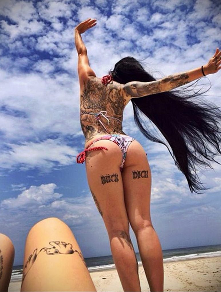 man with tattoo on the beach - photo 4