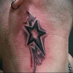 csillag és törzsi minta - tetoválás az ember nyakán - fotó