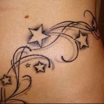 татуировка звезда на женския корем
