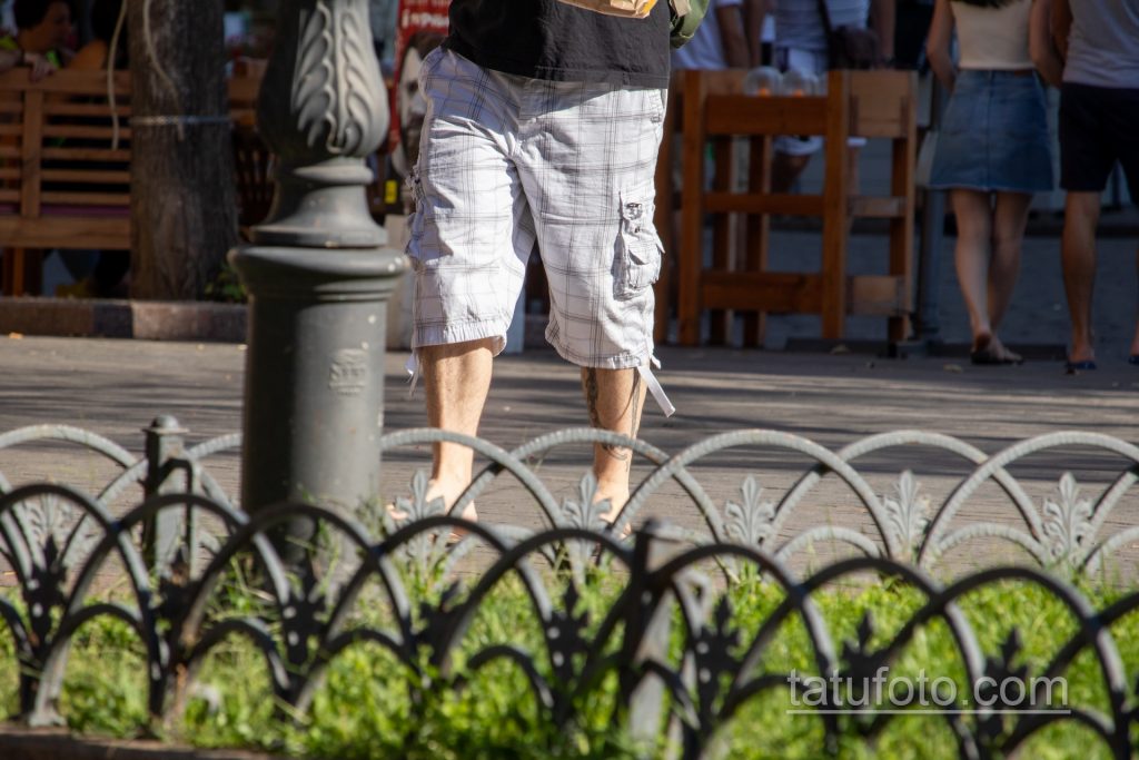 وشم السجن على جسد الرجل - أغلال ونقوش - وشم الشارع 09/14/2020 - 1