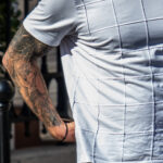 Tatuaż na rękawie z zamkami feniksa i portretem świętego na ramieniu mężczyzny - Street tattoo -29.09.