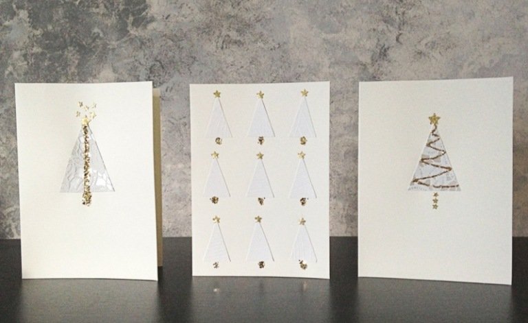 Elegantné vianočné pohľadnice s jedľami v bielej a zlatej farbe drotár vianočné karty sami elegantný dizajn jedle biele zlato